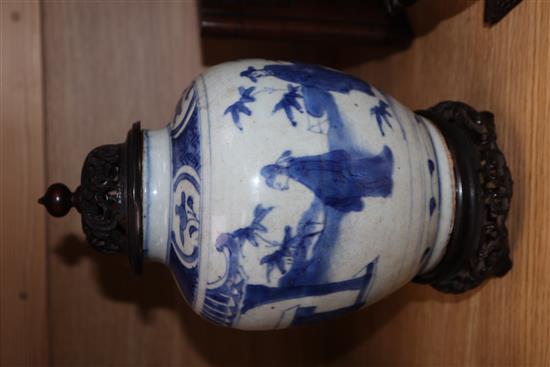 A Chinese Ming blue and white jar, Wanli period, hare mark, with hardwood stand and cover height excl. stand and cover 17cm